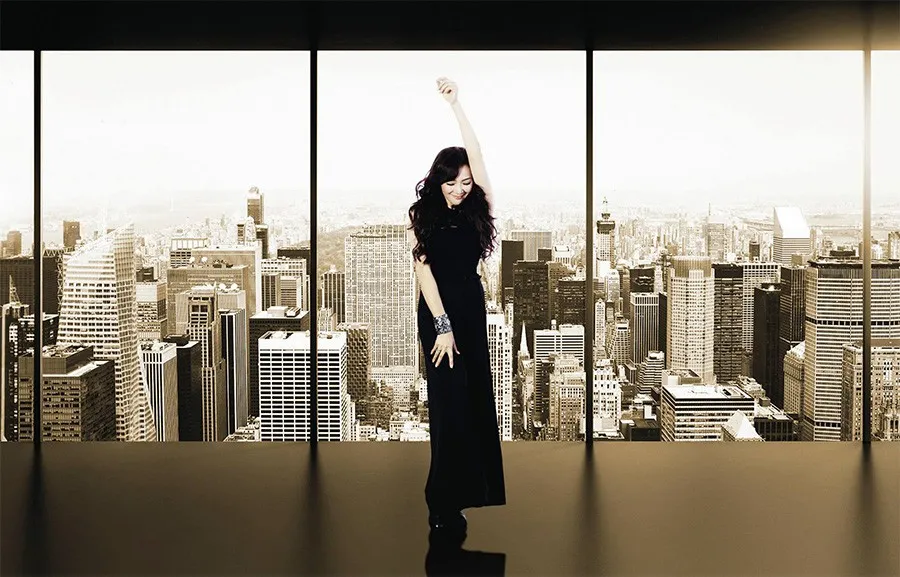 Japanese singer Anri in the 1980s, with a city backdrop.