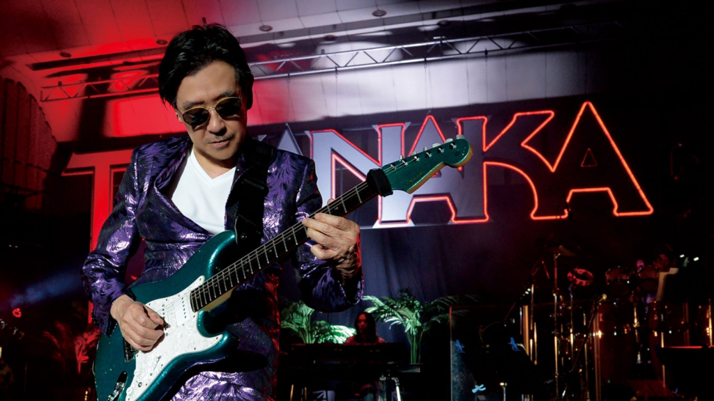 Masayoshi Takanaka with guitar.